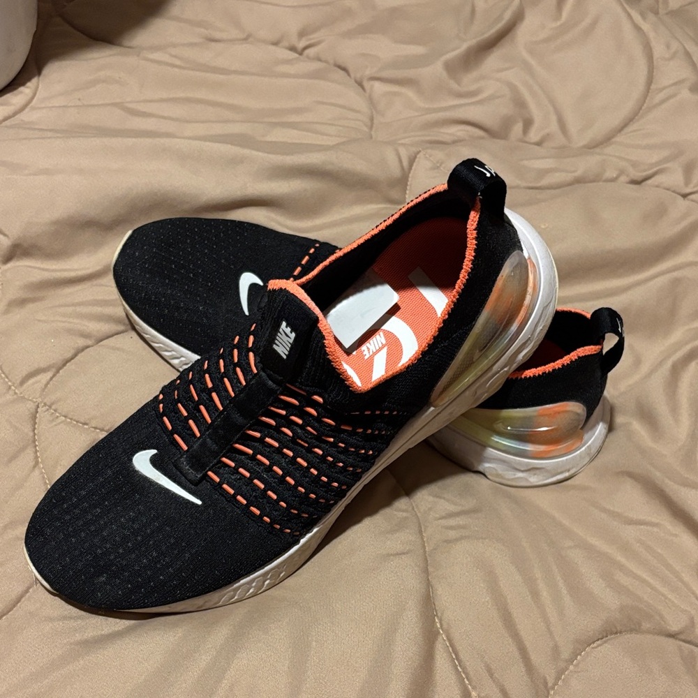 Nike women’s  Black and Orange Slip-On Sneakers